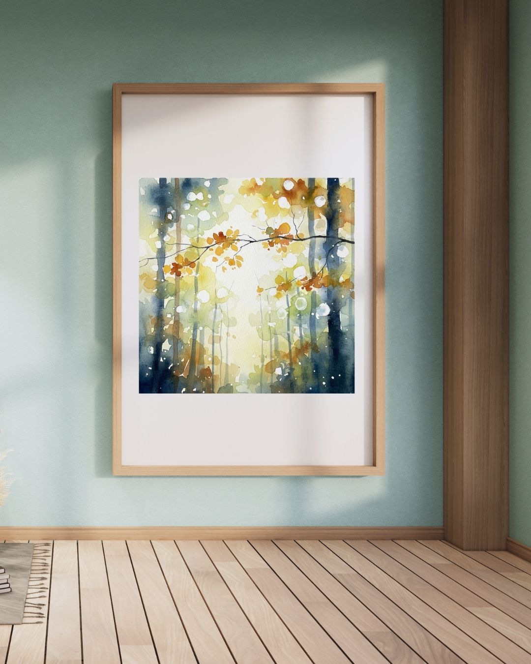Framed artwork of a forest scene on a wall with wooden floor and column.